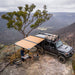 Black truck with roof tent on mountain - arb awning full arm 2500 black awning only