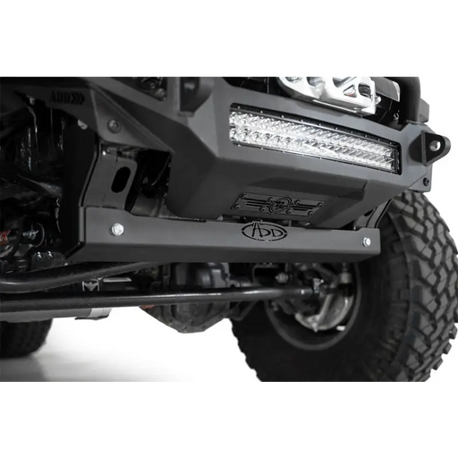 Close up of black ATV front bumper and bumpers on Addictive Desert Designs skid plate.
