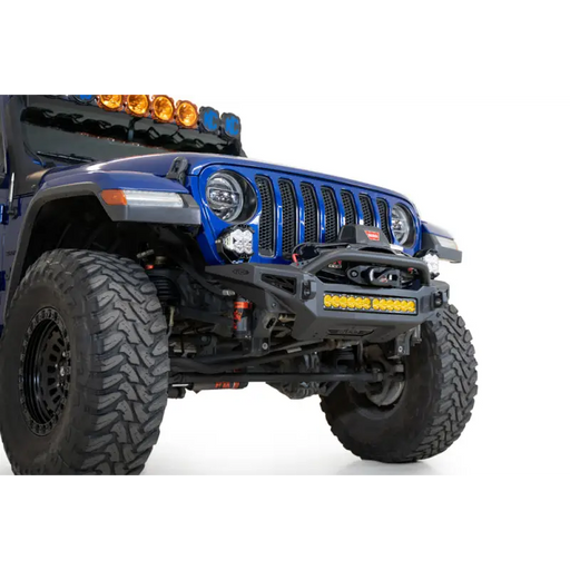 A close up of a blue jeep with a light on
