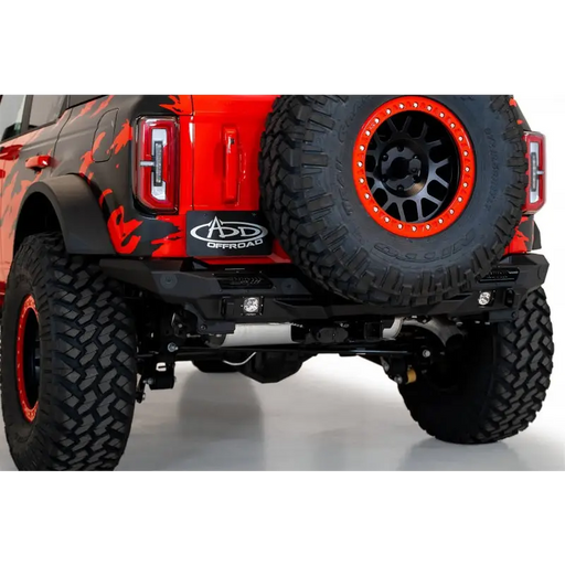 Red truck with black tire - featured in Addictive Desert Designs 21-22 Ford Bronco Stealth Fighter Rear Bumper