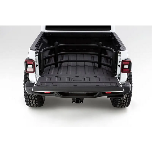 AMP Research Bedxtender HD Sport for 20-22 Jeep Gladiator - Black, rear view with trunk open.