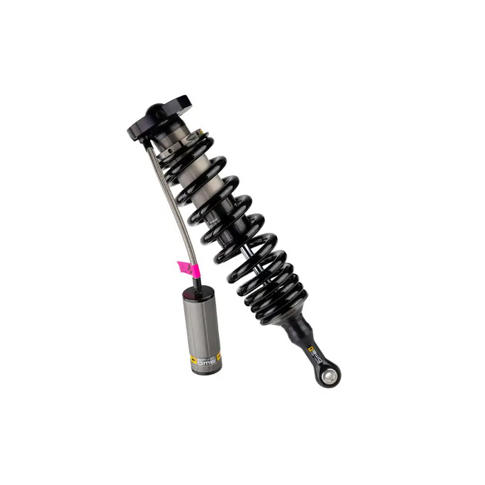 Close up of ome bp51 coilover suspension with metal object