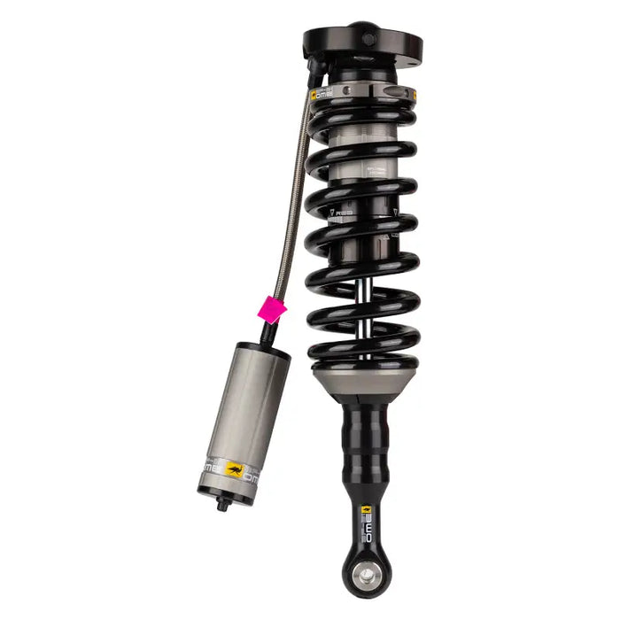 Close up of ARB / OME BP51 Coilover shock absorber and metal object.