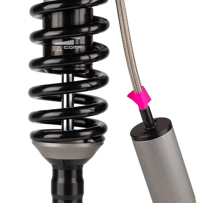 Close up of shock absorber and metal pole in ARB / OME BP51 Coilover for Tacoma from Man Emu