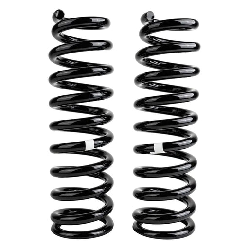 Black OME coil springs on white background - ARB / OME Coil Spring Front Prado To 2003
