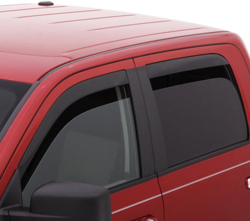 Red van with black roof rack driving with avs window deflectors for fresh air