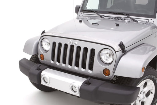 Front view of a white jeep with avs aeroskin low profile hood shield - chrome, special hardware required