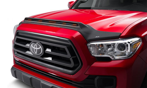 Front end of a red 2019 toyota tacoma with avs aeroskin lightshield pro in black