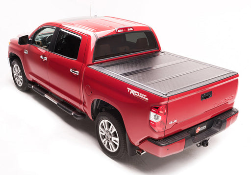 Red truck with black bed cover - bakflip g2 for toyota tundra double cab