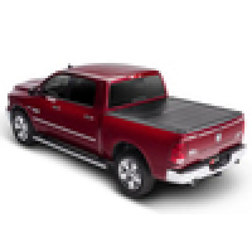 Red truck with black bed cover on BAKFlip F1 for 16-20 Toyota Tacoma.