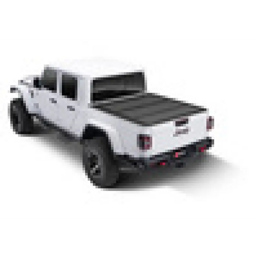 White and black BAKFlip MX4 bed cover on 2020 Jeep Gladiator.