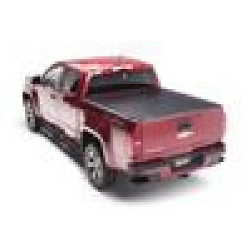 Red toy car on white background - BAK 2020 Jeep Gladiator 5ft Bed Revolver X2