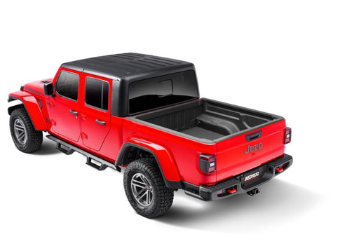 Red jeep gladiator truck bed mat with black top for impact protection