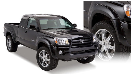 Black truck with pocket style fender flares for toyota tacoma, white background