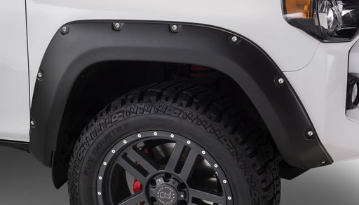 Front view of white toyota 4runner with black wheels - bushwacker pocket style flares