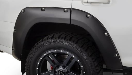 White truck with black wheels and tire - bushwacker toyota 4runner pocket style flares black