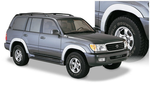 Gray suv with black tire cover featuring bushwacker 98-07 toyota land cruiser oe style fender flares - black
