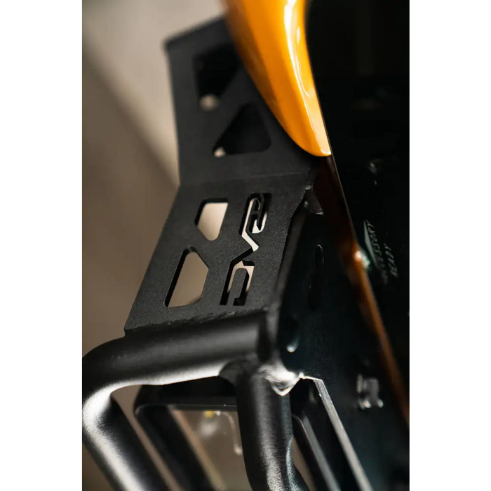 Yellow handle gun close up featured in DV8 21+ Ford Bronco Curved Light Bracket product.