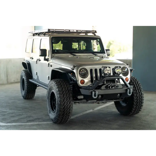 White Jeep parked in parking lot next to DV8 Offroad Slim Fender Flares for Jeep Wrangler JK