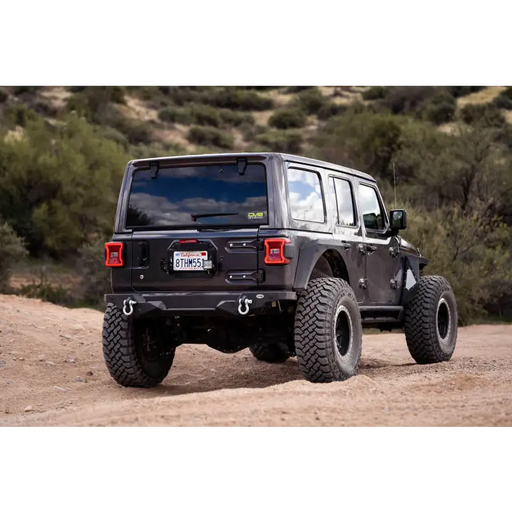 DV8 Offroad Jeep Wrangler JL Spare Tire Delete Kit with Light Mounts - Rear view of black Jeep bumper