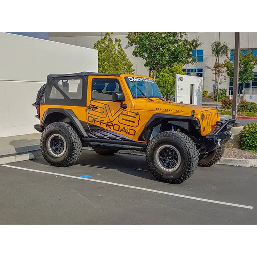 Yellow Jeep Wrangler with black and white decal, DV8 Offroad Armor Style Fenders