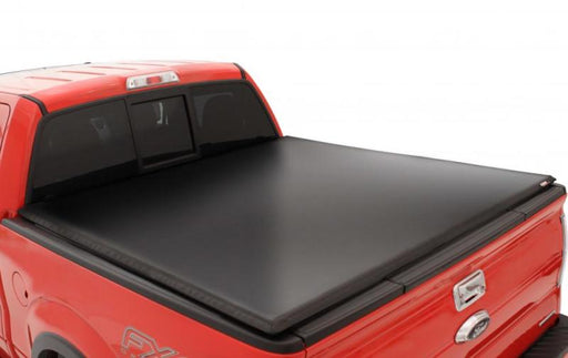 Black lund genesis tri-fold tonneau cover for toyota tacoma (6ft. Bed) - truck with bed cover