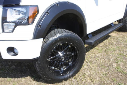 White truck with black wheels and lund’s rx-rivet style fender flares