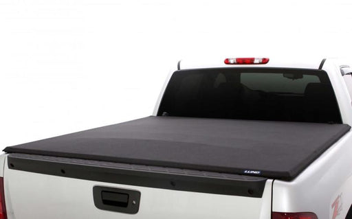 Black lund genesis elite tri-fold tonneau cover for toyota tacoma with 5ft. Bed