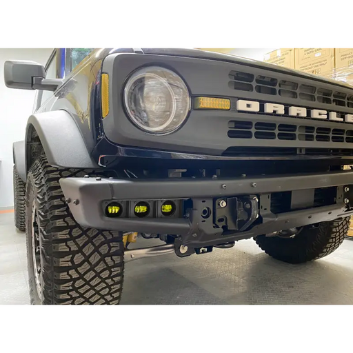 Black truck with yellow LED fog light from Oracle Lighting for Ford Bronco.