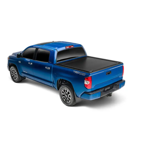Blue truck bed cover with Trax Rail system for 16-18 Tacoma Double Cab.