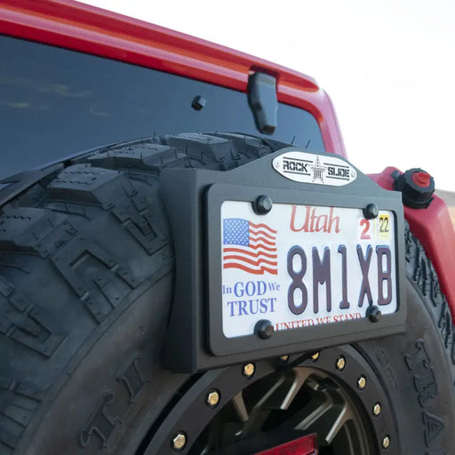 Red Jeep with License Plate on Rock Slide Any Size Spare Tire Ez Plate