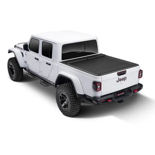 Roll-N-Lock 2020 Jeep Gladiator 5ft bed M-Series Retractable Tonneau Cover featuring white truck with black top and wheels