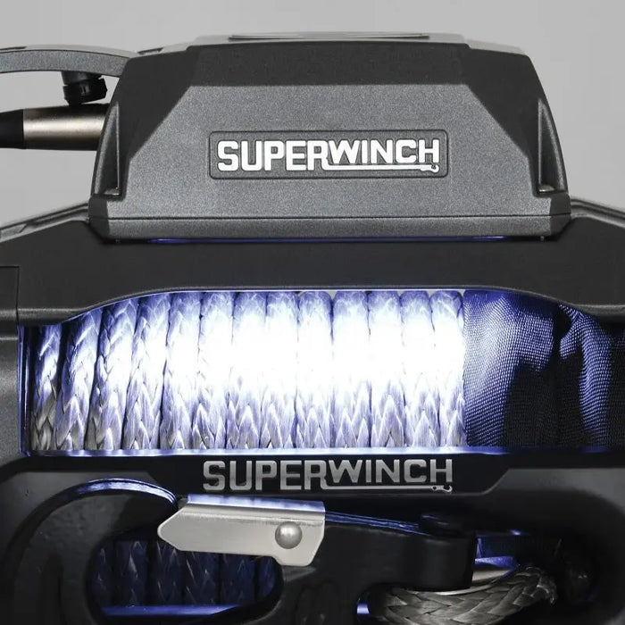 Front light of motorcycle with ’superwin’ displayed on Superwinch 10000 LBS 12V DC 3/8in x 80ft Synthetic