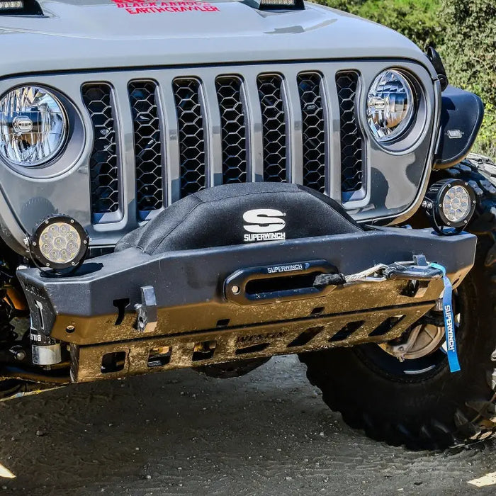 Superwinch winch cover for integrated winches with black neoprene - jeep with big tire parked on road