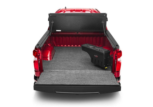 Undercover toyota tacoma swing case for truck bed - red truck with open trunk compartment