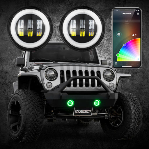 Close up of xk glow 4in black rgb led jeep wrangler fog light with app controlled kit and cell phone