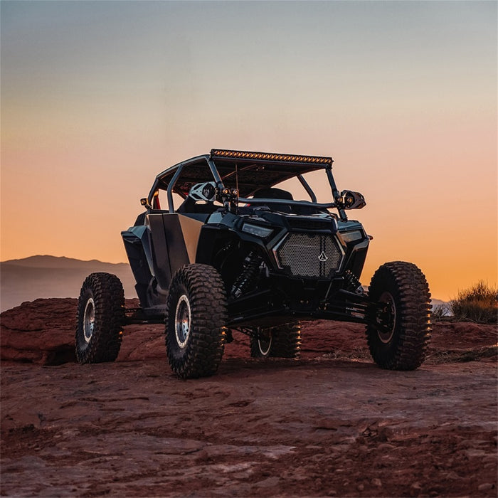 Rigid industries revolve light pod on rocky hill with sunset background