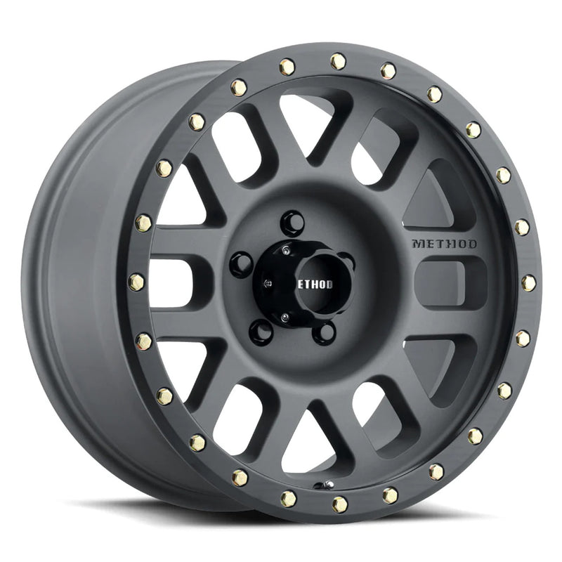 Method mr305 nv 17x8.5 titanium matte black lip wheel with gold studs