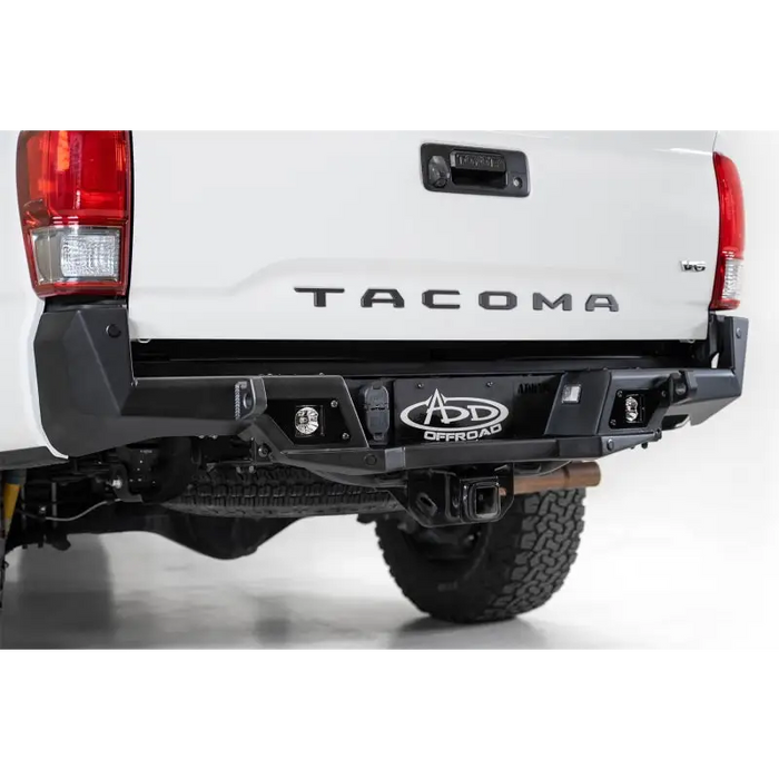 Close up of Addictive Desert Designs Toyota Tacoma Stealth Fighter Rear Bumper with Backup Sensor Cutouts