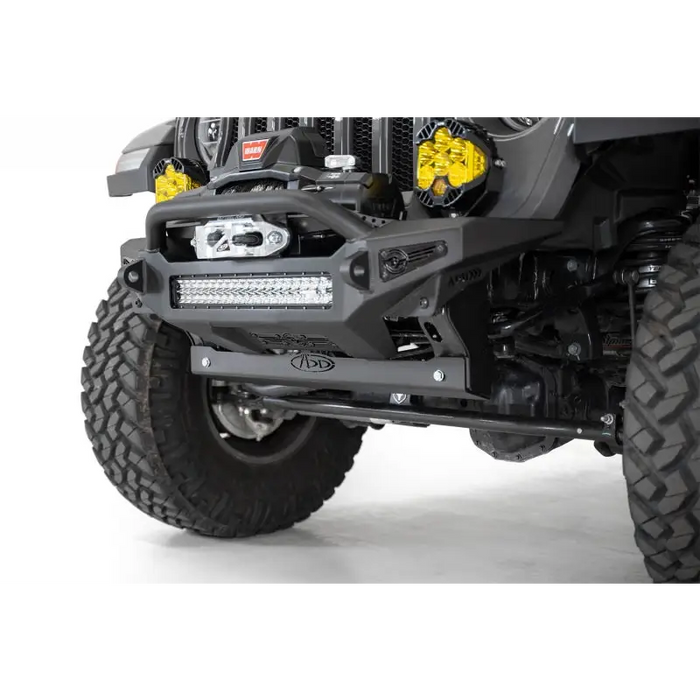 Black Jeep with Yellow Light on Addictive Desert Designs Sway Bar Skid Plate