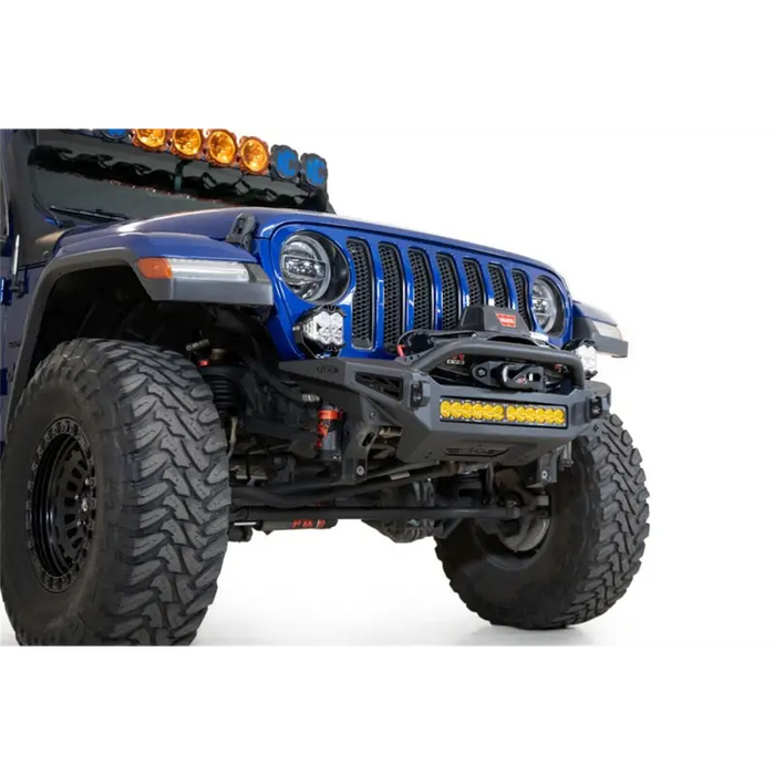 Blue jeep with light on top - addictive desert designs rock fighter bumper.