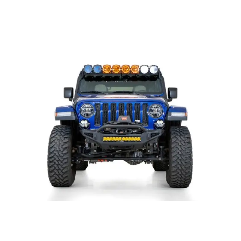 Blue jeep with lights on front bumper by addictive desert designs