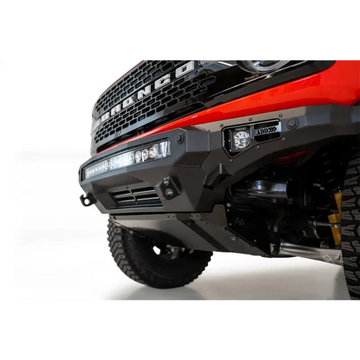 Red truck with big bumper - Addictive Desert Designs 2021+ Ford Bronco Stealth Fighter Front Bumper Skid Plate Kit