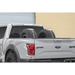 White truck with large tire on back in Addictive Desert Designs Universal Tire Carrier