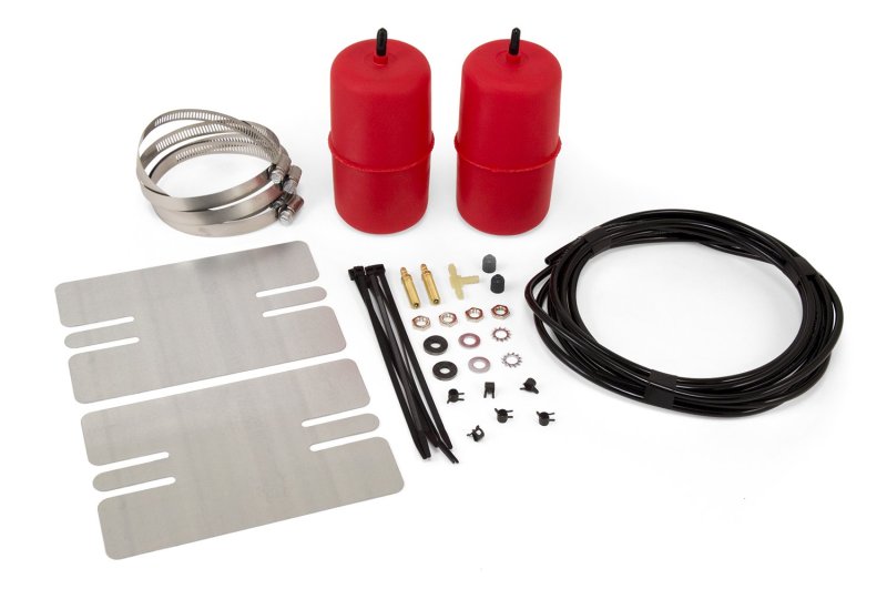 Air lift 1000 universal 3in/8in air spring kit featuring red air bags and hose on white surface