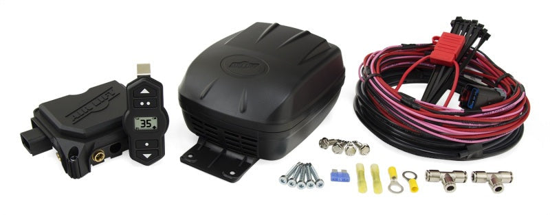 Close up of air lift wireless one (2nd generation) car wiring kit with wires and air pressure components