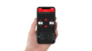 Hand holding smartphone with air lift wireless air tank kit remote control app