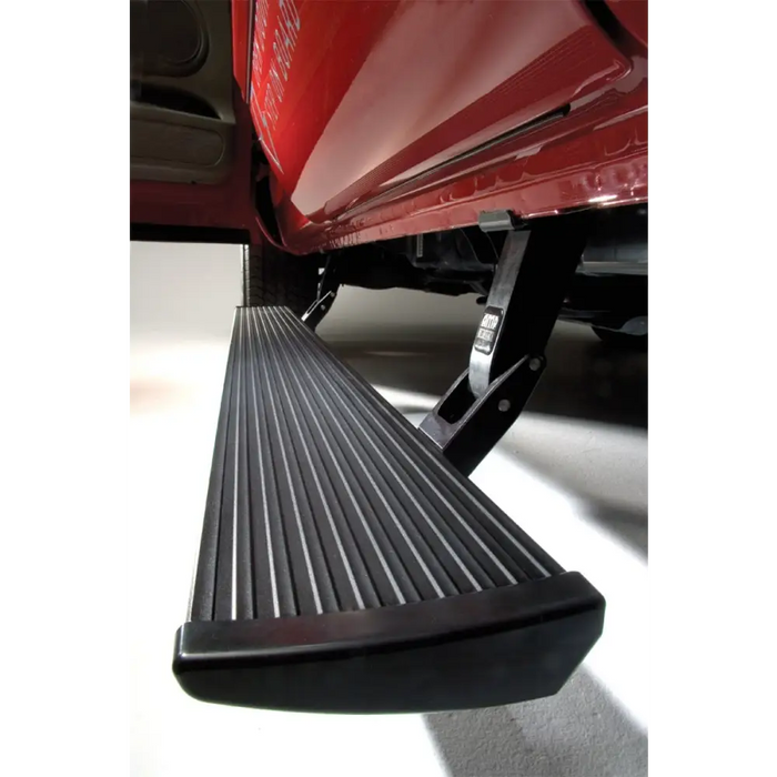 Black amp research powerstep for toyota 4runner with side step and red truck.