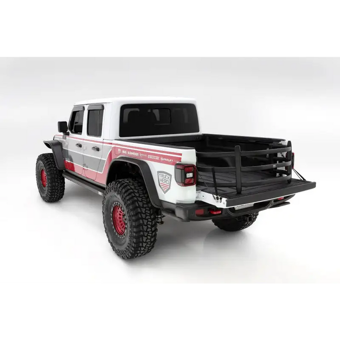 White truck with red accents and black bumper, AMP Research Bedxtender HD Sport for 20-22 Jeep Gladiator.