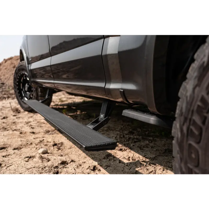 AMP Research truck with tire tread on side - PowerStep Xtreme in Black.